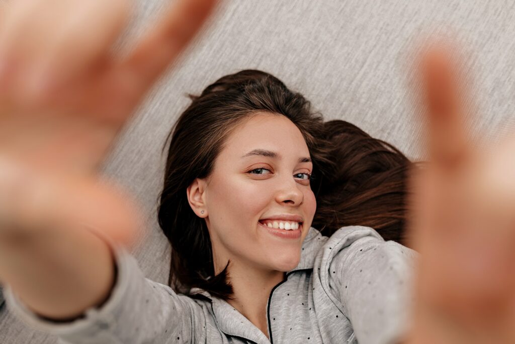 happy lovable girl with dark hair wearing pajamas 2021 08 31 22 18 43 utc