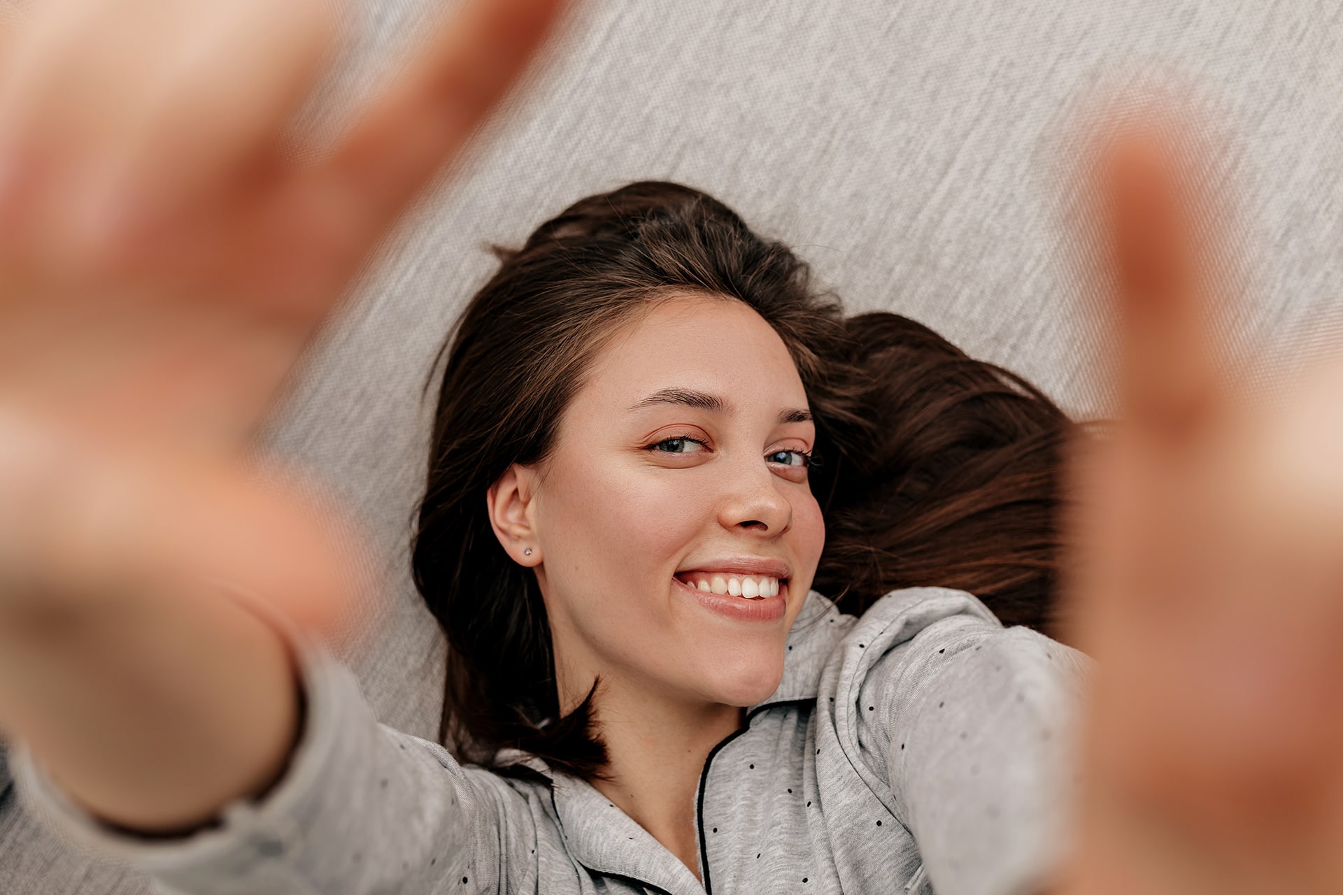 happy lovable girl with dark hair wearing pajamas 2021 08 31 22 18 43 utc
